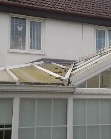 Before: a grubby, green-tinged conservatory roof.